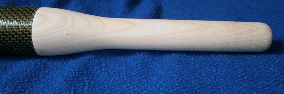 Copy turned Ash Oar handles turned to fit a carbon fibre tube.